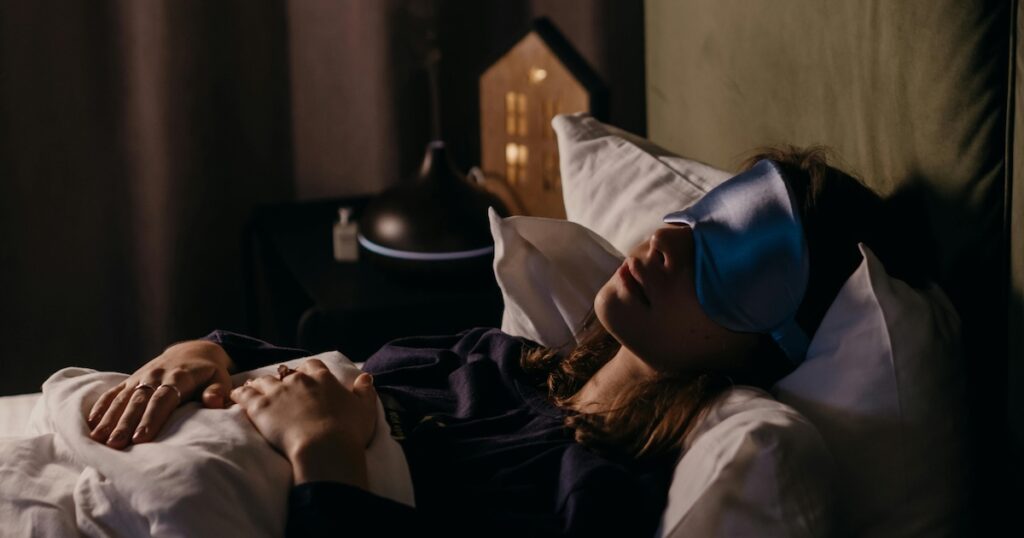 woman in lavender sleep mask